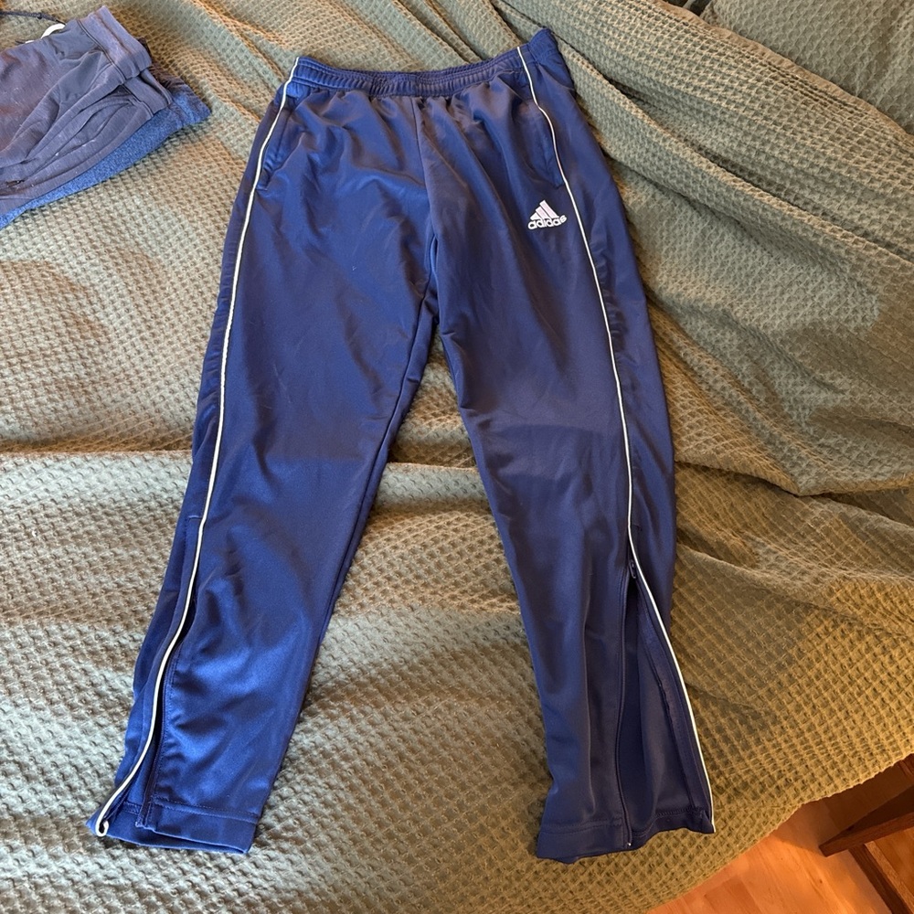 Adidas navy blue slim fit sweat pants with zip bottoms